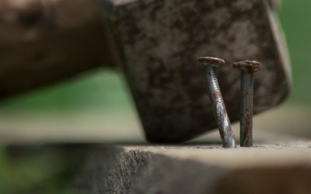 hammering nails in wood