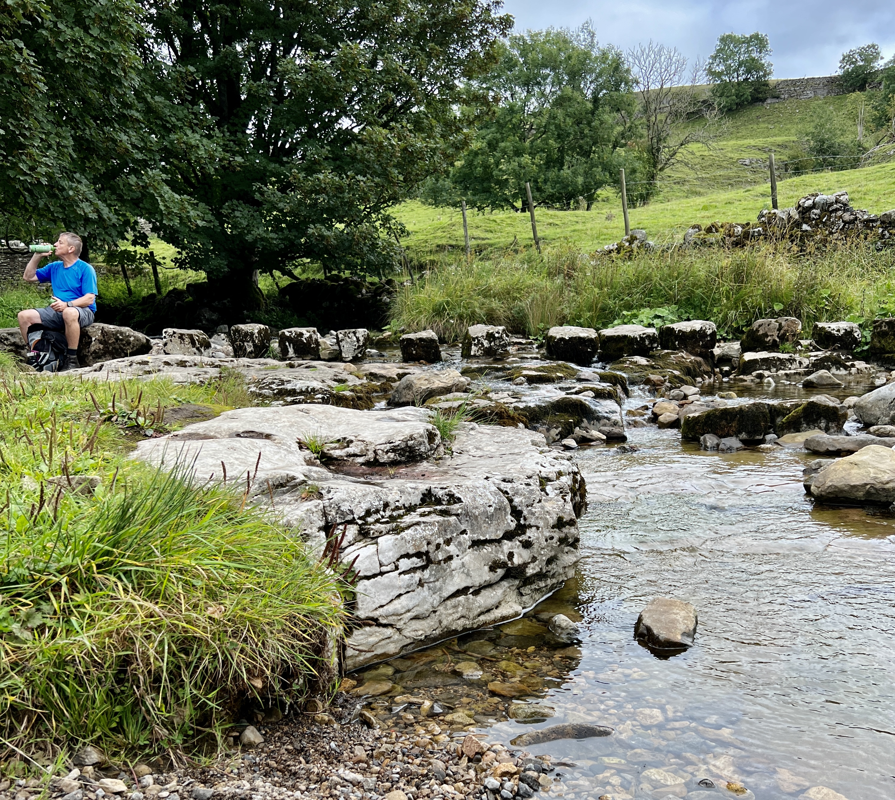 hiker stopping for a drink of water