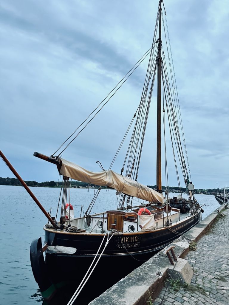 photo of the St Nikolaj sailboat tied-up at the marina in Ærø.