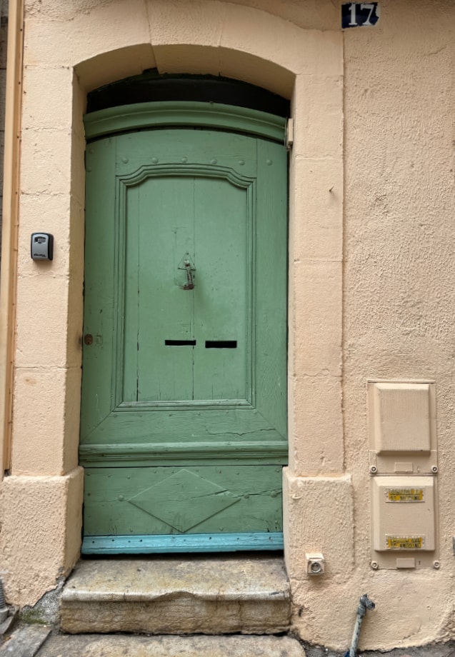 a door , green , not very pretty, and needs repair