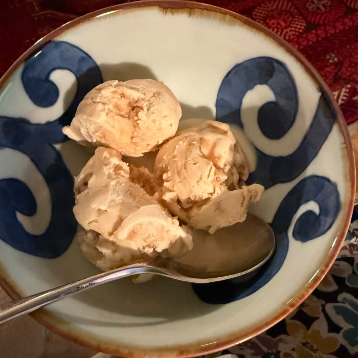 a bowl of incense cream with a spoon