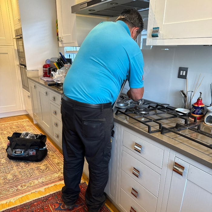 photo of repairman fixing my hob/cooker/stove