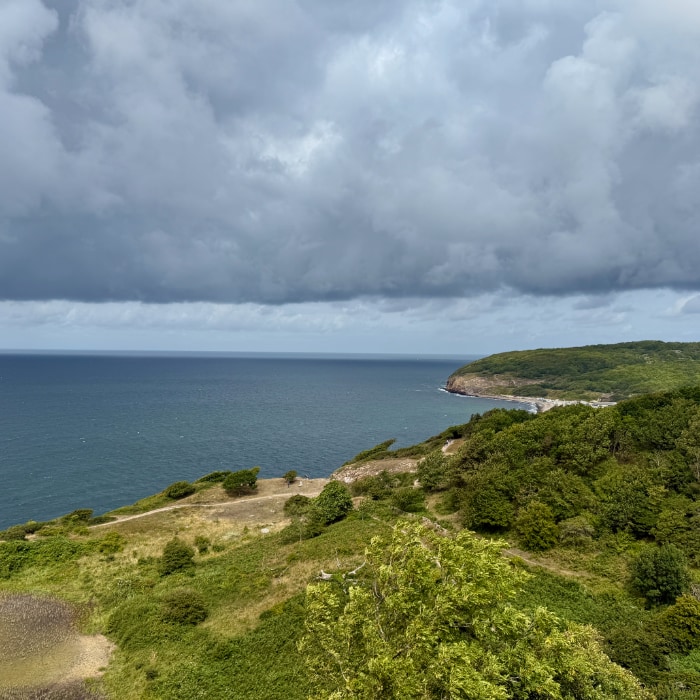 a view at sea with clouds at the horizon