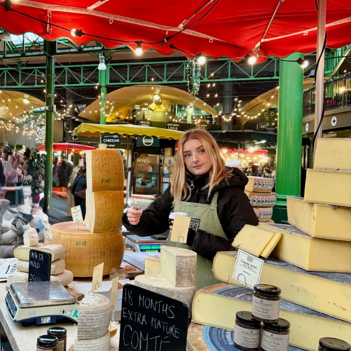 The girl with her cheese pop-up shop at the market