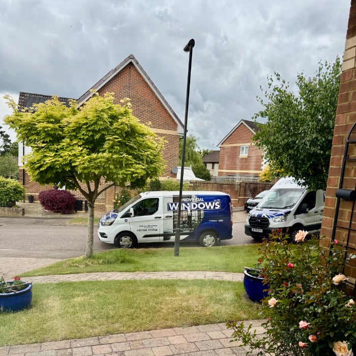 workmen's vans parked in front of my house