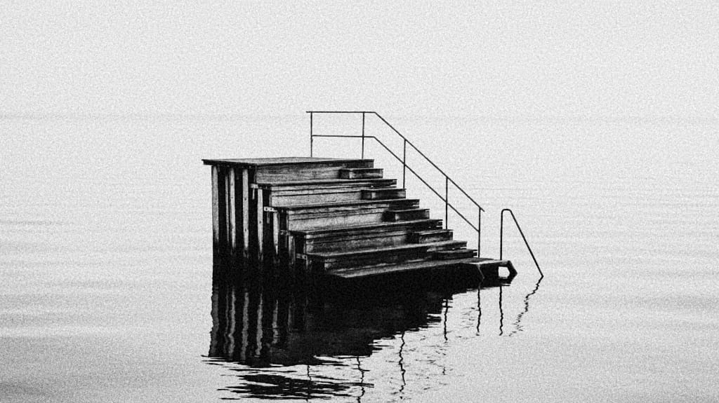 b/w photo of wooden stairs in water