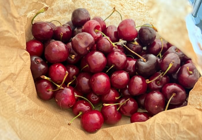 cherries in a paper bag