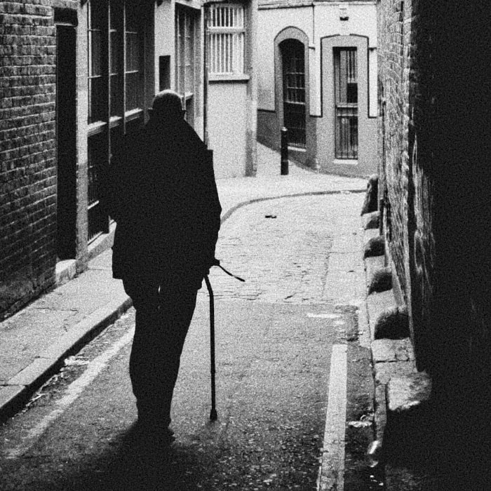 a man walking in the alley of Arundel